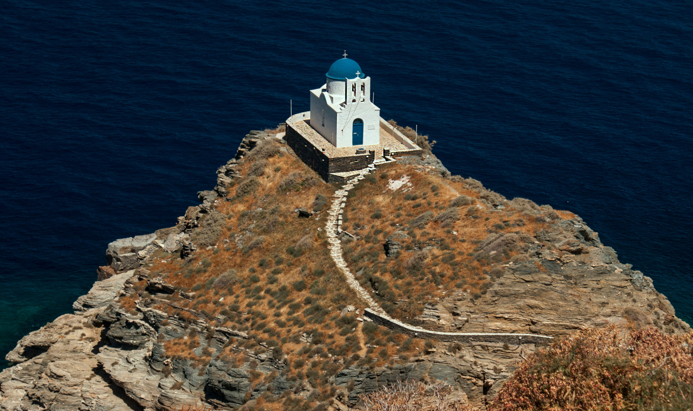 Which is the small Greek island with the 235 churches?